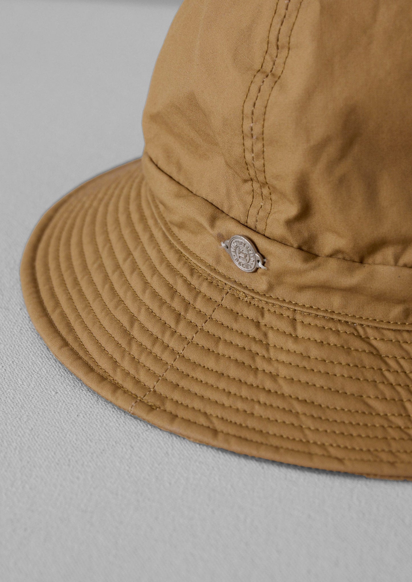 Cappello in cotone cerato Decho | Beige