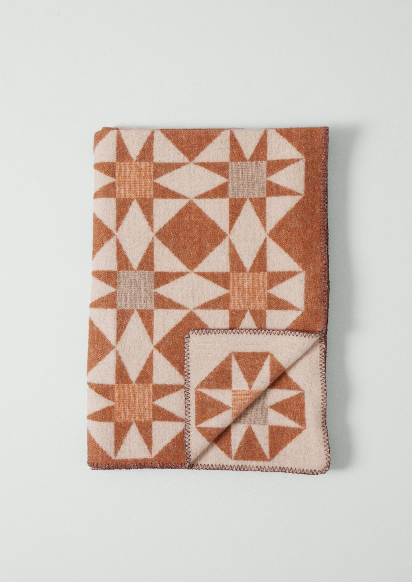 Coperta in lana Jacquard Star | Ruggine/Pesca morbida