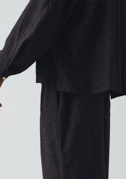 Pantaloni a pieghe in cotone e cashmere a quadri | Nero/Ecru